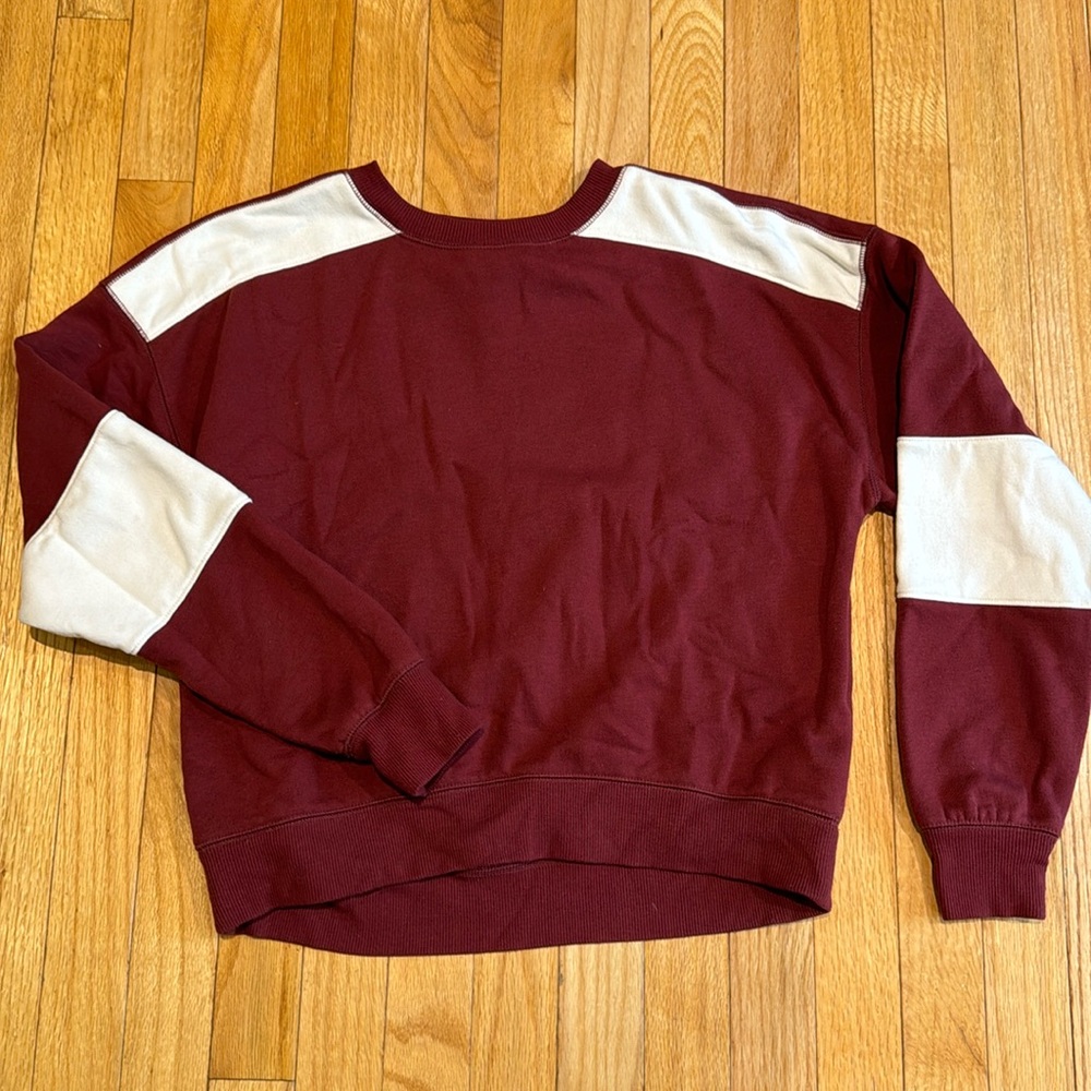 Red and white sweatshirt, size small.